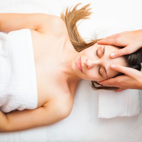 Beautiful woman having an head massage